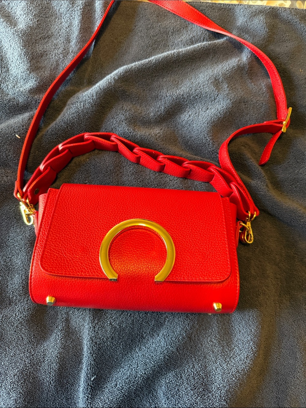Elegant Red Crossbody Bag with Gold Accent